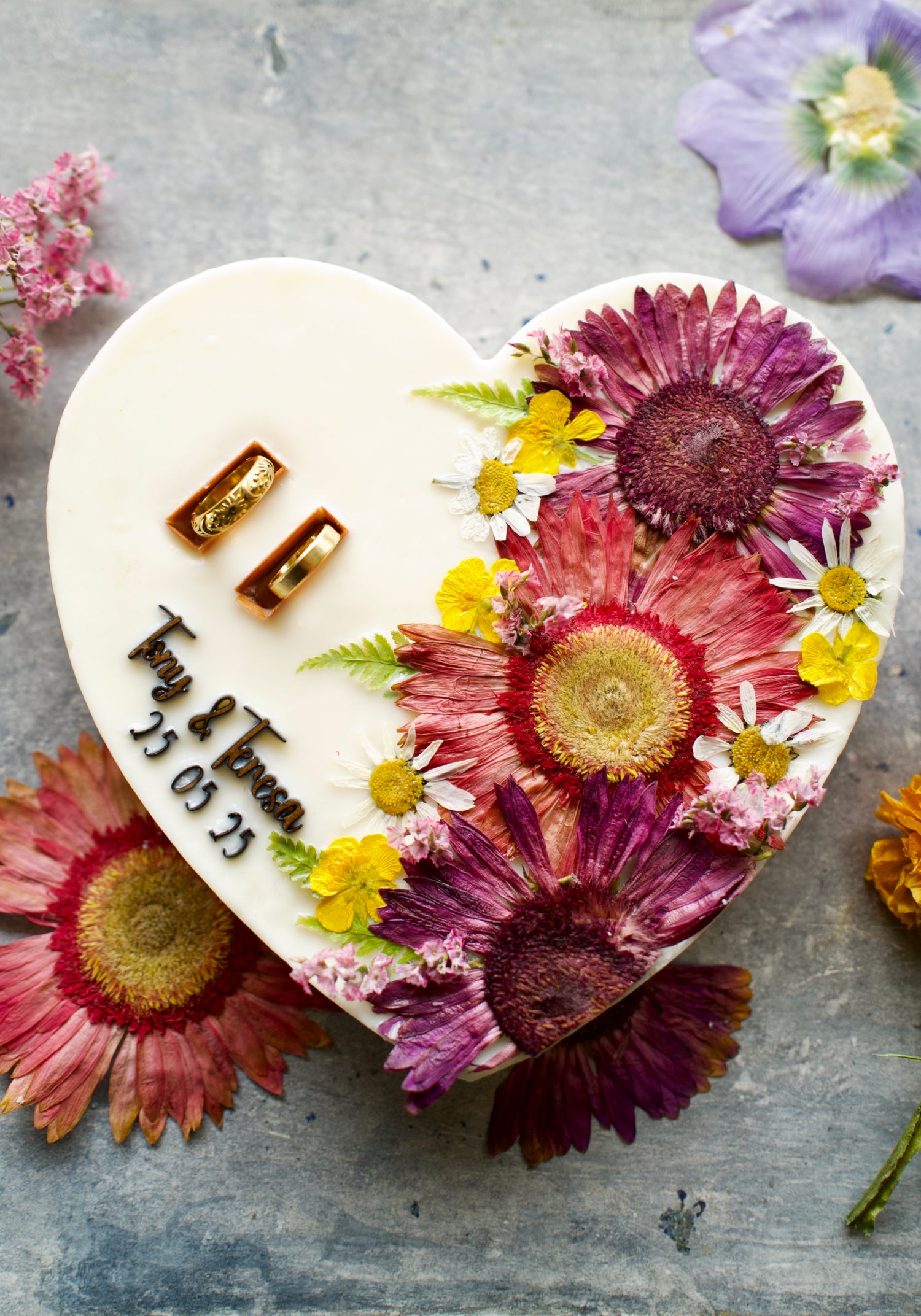 Heart-shaped candle as a ring holder for weddings